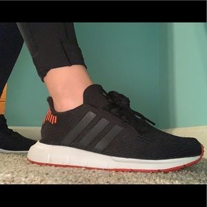 Black and Orange Adidas Swift Run sneakers
